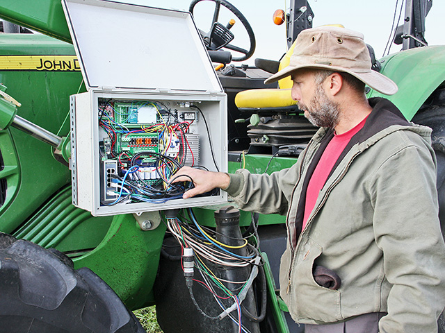 Kyler Laird&#039;s controller box on his John Deere 6330 manages multiple functions, including engine cutoff, throttle, steering, reverse and hitch. (DTN/The Progressive Farmer photo by Des Keller)